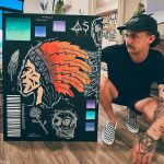 Spokane Artist Austin Steiner with a piece of artwork